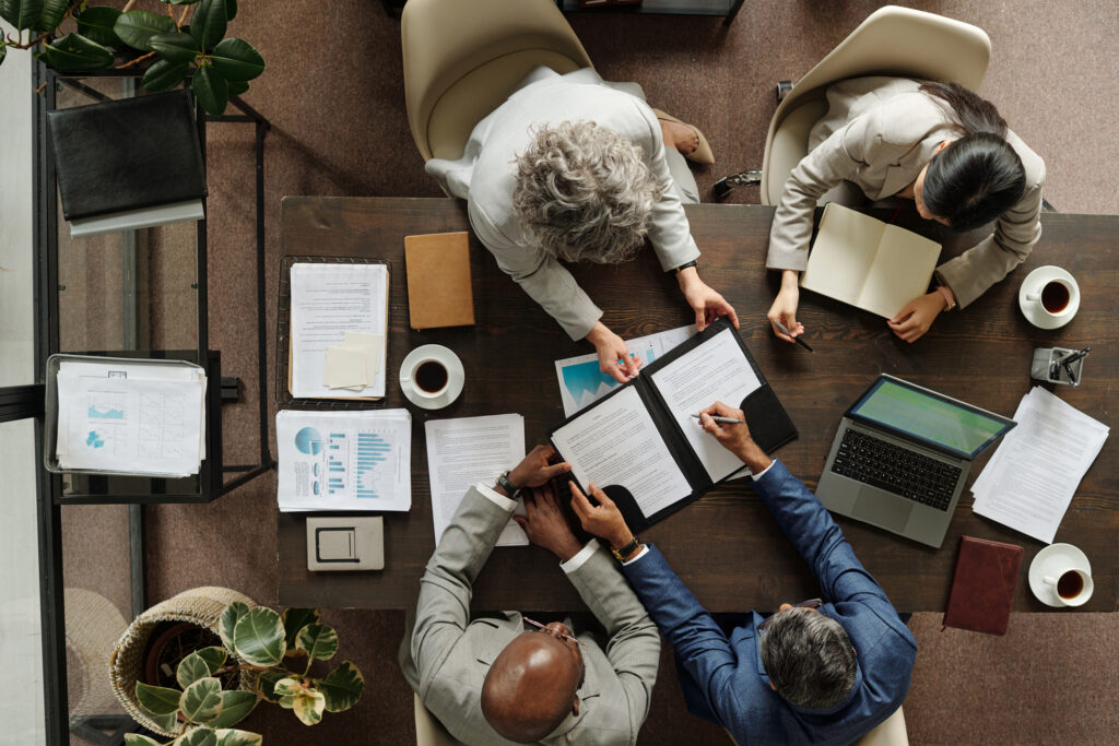 Group of business people making decisions at a table